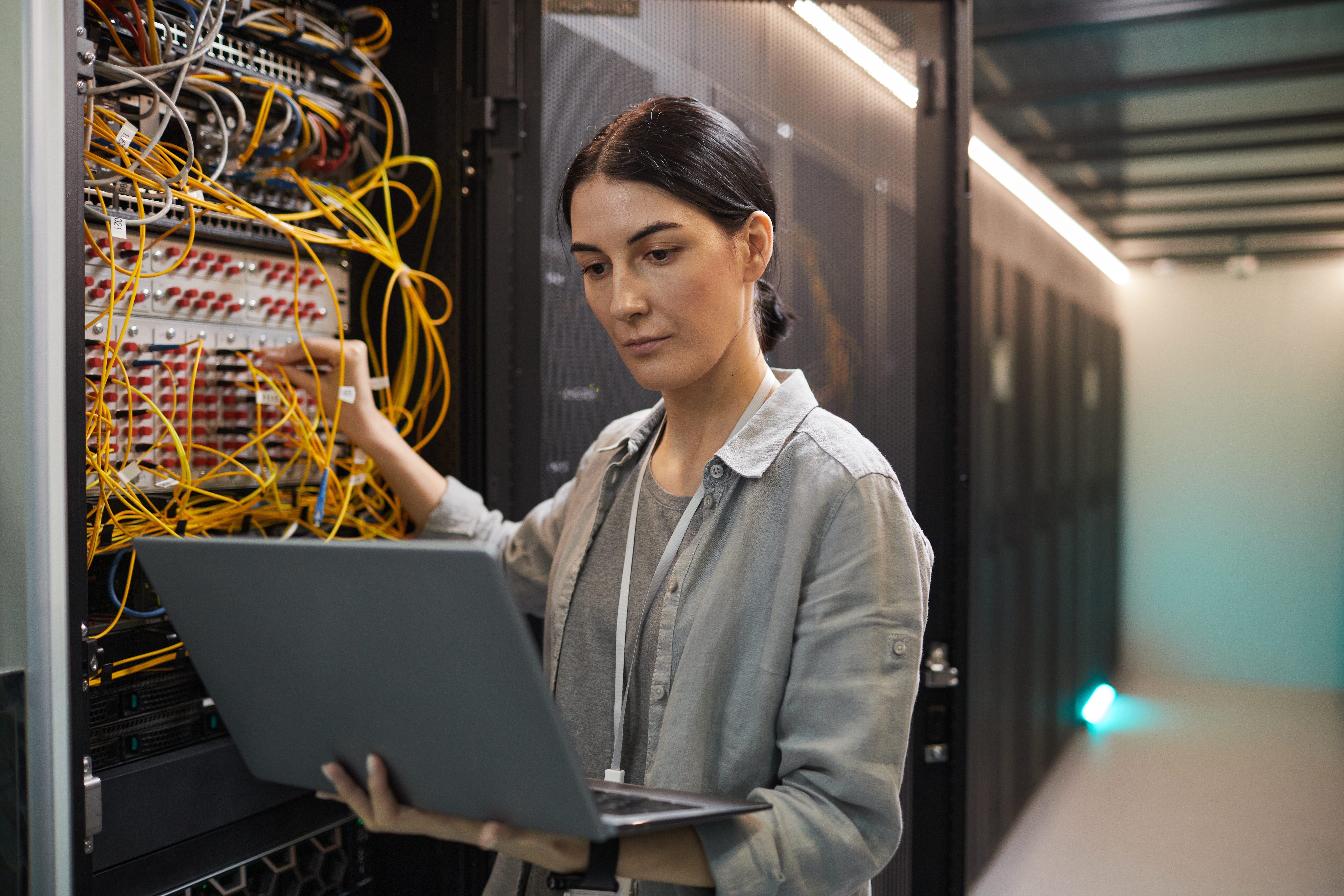 HDE engineer at work in server room
